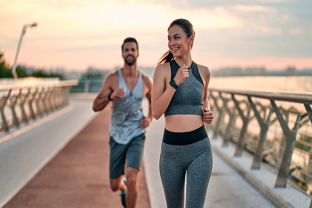 Fit couple goes for a run to maintain their new body contours