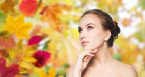 Woman in her early 40s has smooth skin while enjoying nature.